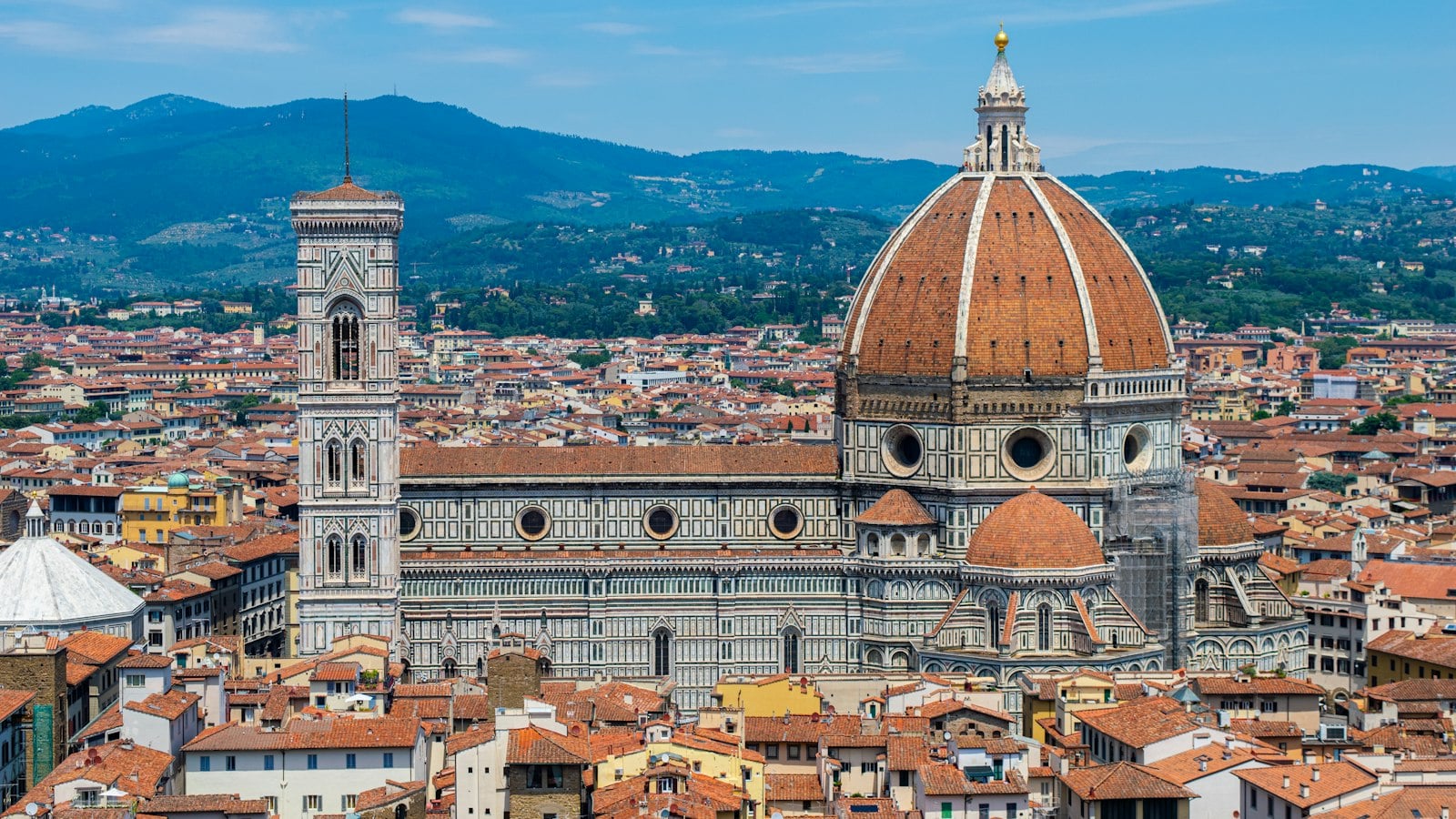 The dome of Florence Cathedral and Giotto’s bell tower above the city rooftops (photo: Joseph Quam / Unsplash)