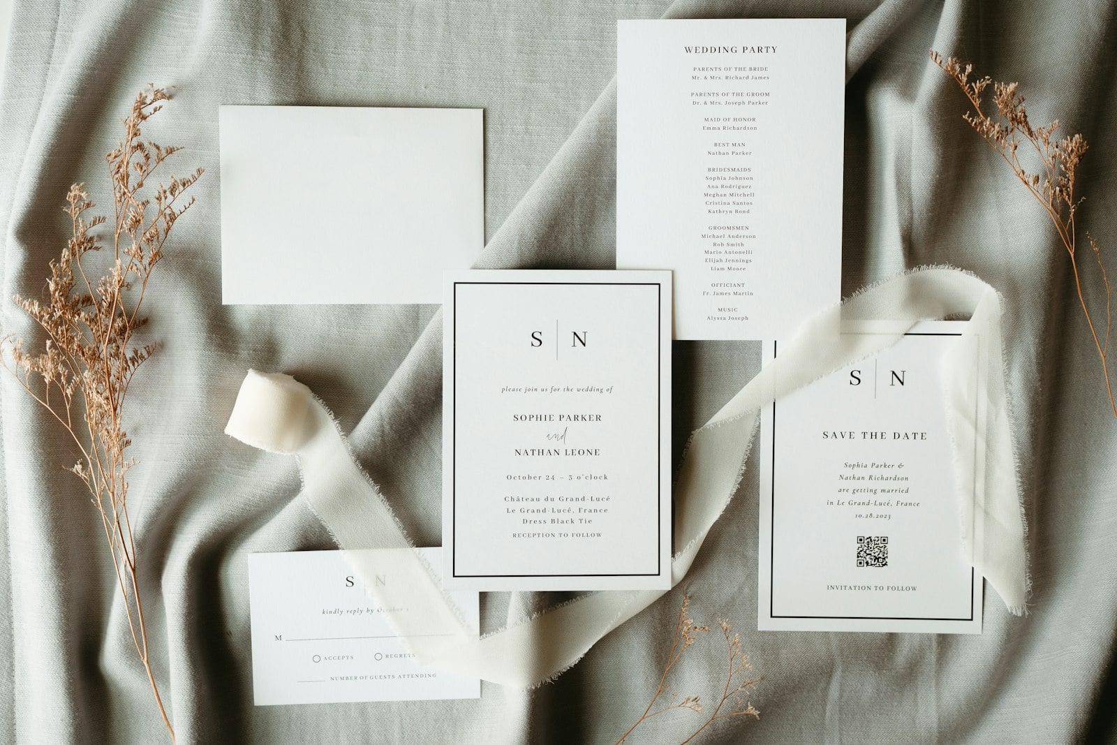 Wedding invitation suite with ribbon on linen (photo: Micah & Sammie Chaffin / Unsplash)
